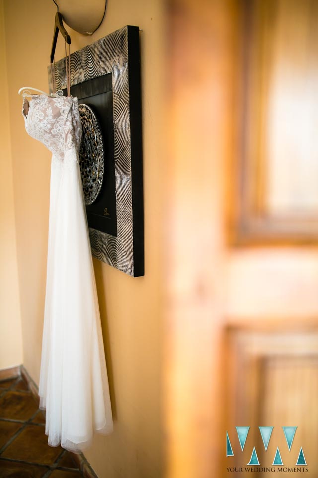 Wedding dress hanging in the Hacienda San Jose bedroom