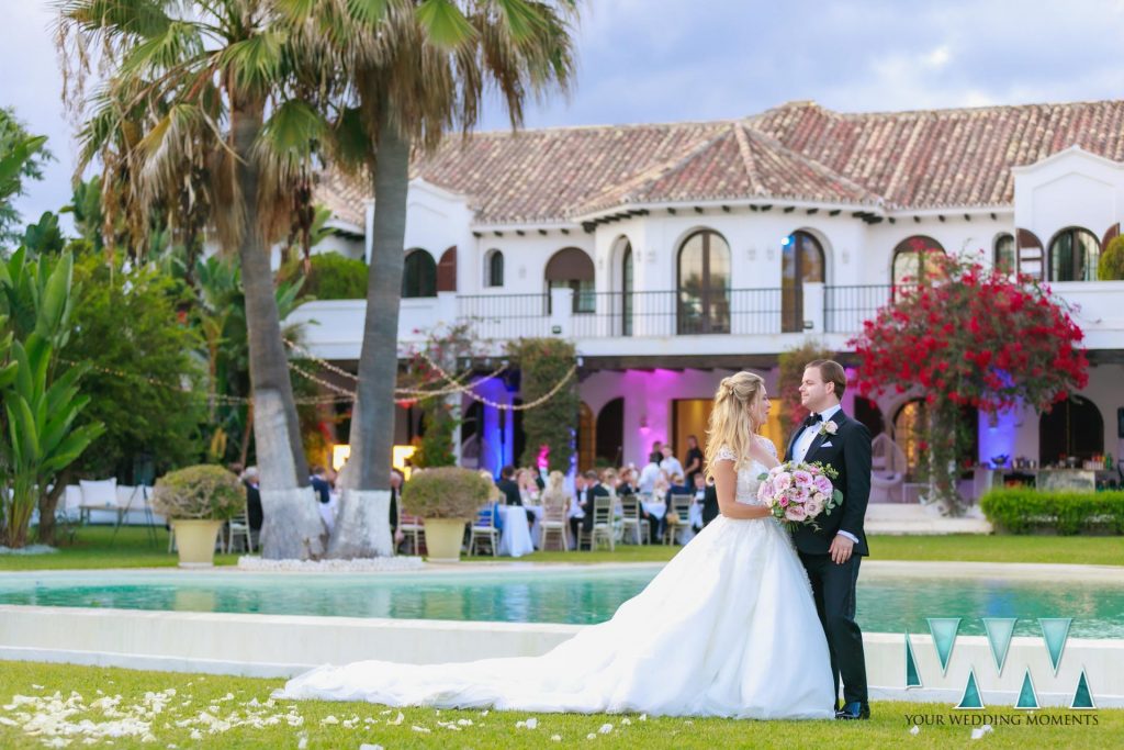 Bride and Groom posing outside Villa Cisne in Marbella