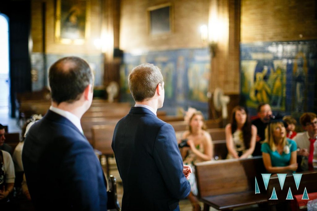 Groom waiting for bride in church in Seville