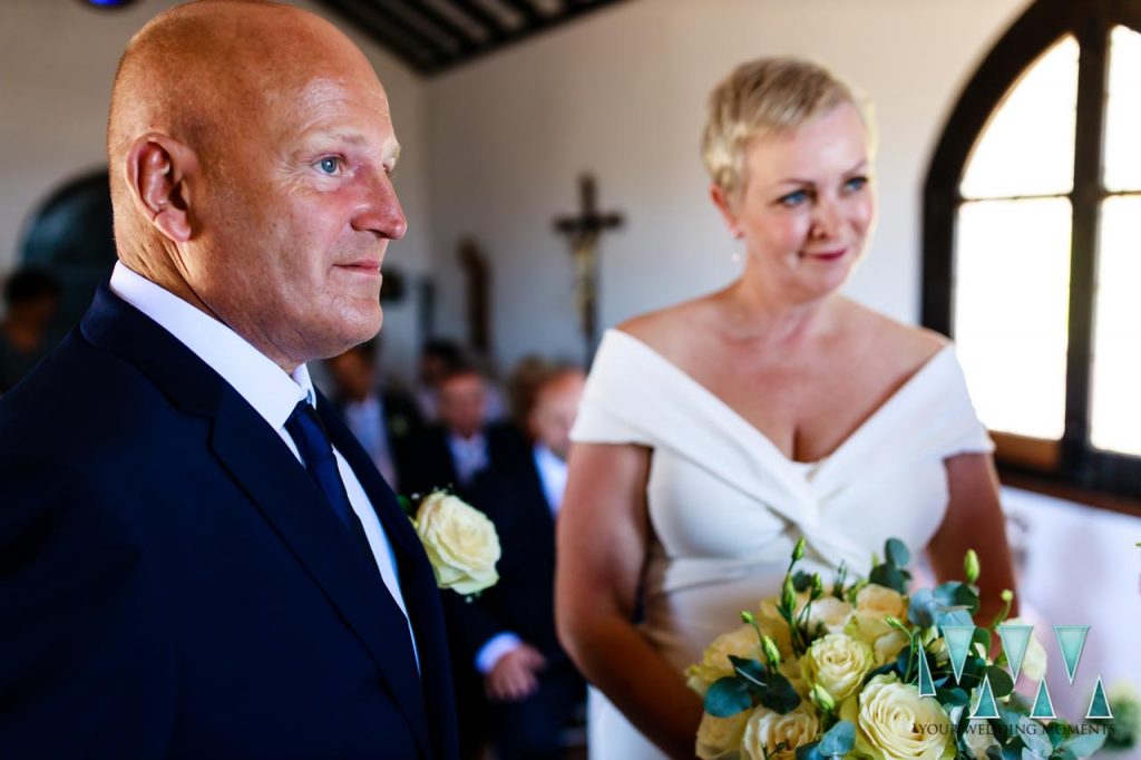 Groom with bride on background