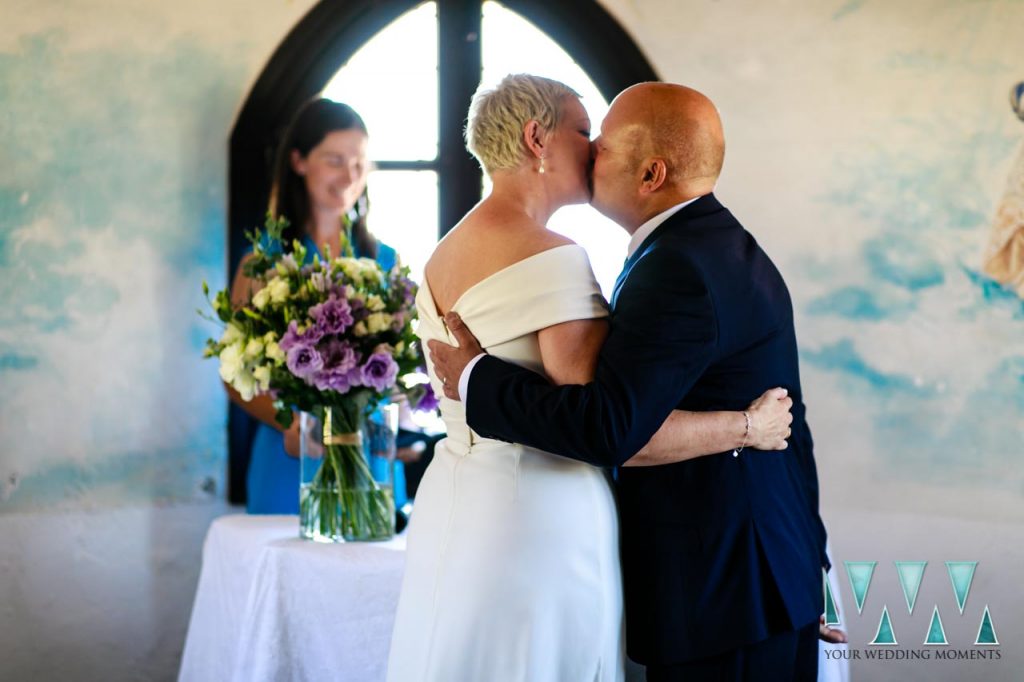Bride and Groom kiss during wedding in Tarifa