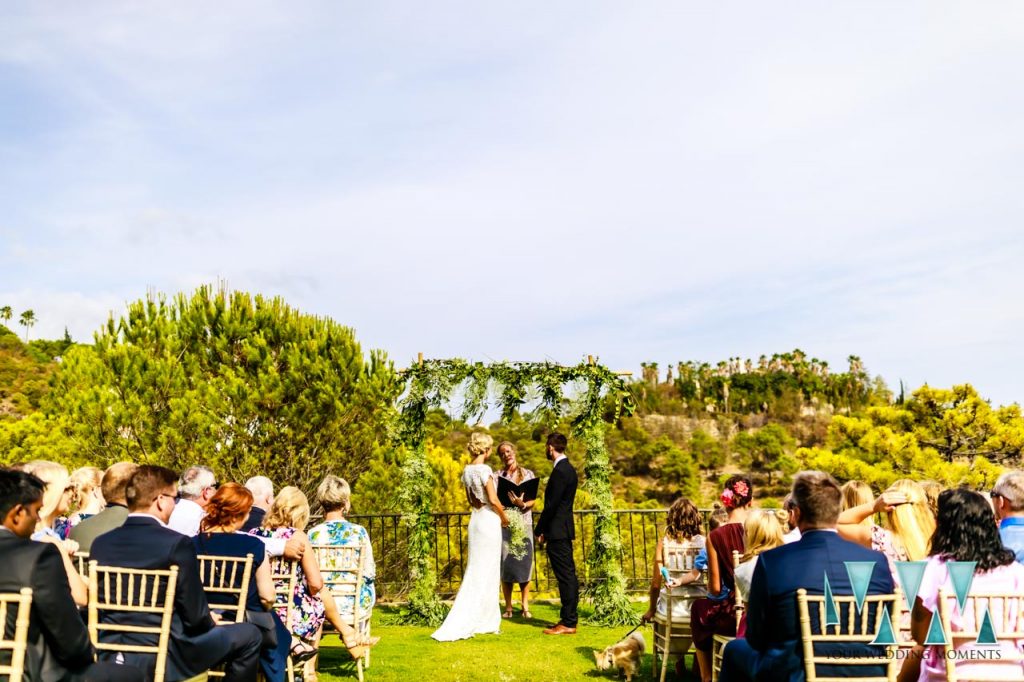 Bride and Groom during wedding ceremony in the gardens of Villa Candela en la Colina