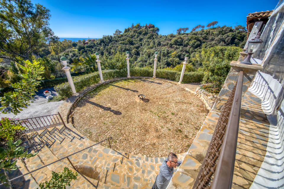 Circular patio ceremony area surrounded by pillars at Casa De La Era