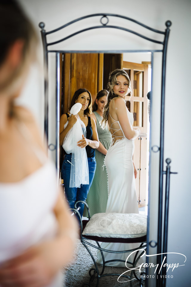 Bridal preperations looking back in the mirror