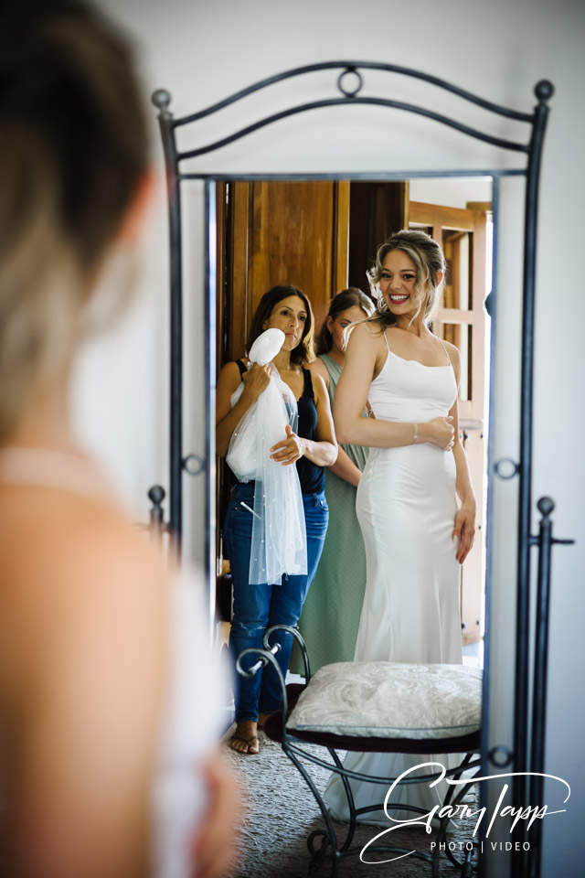 Bridal preperations looking back in the mirror