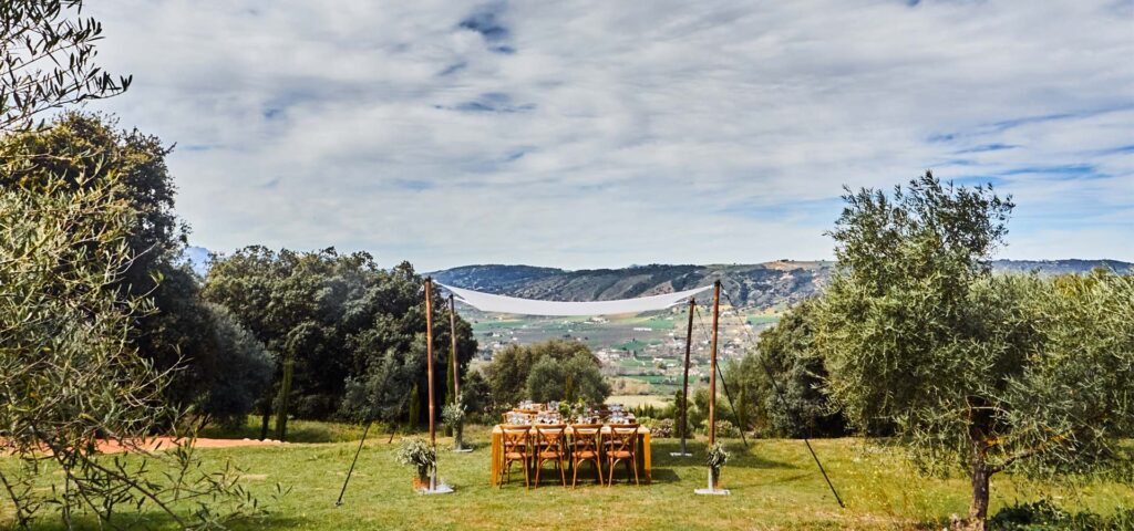 Wedding breakfast setup at Cortijo La Organic overlooking the mountains in Ronda