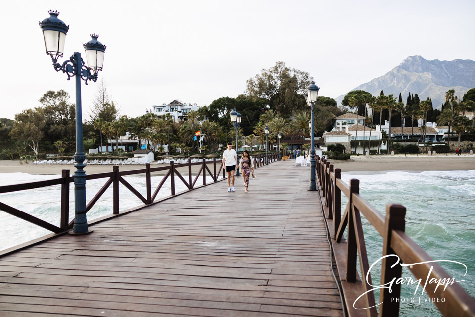 Surprise marriage proposal photography on the pier at the Marbella Club Hotel