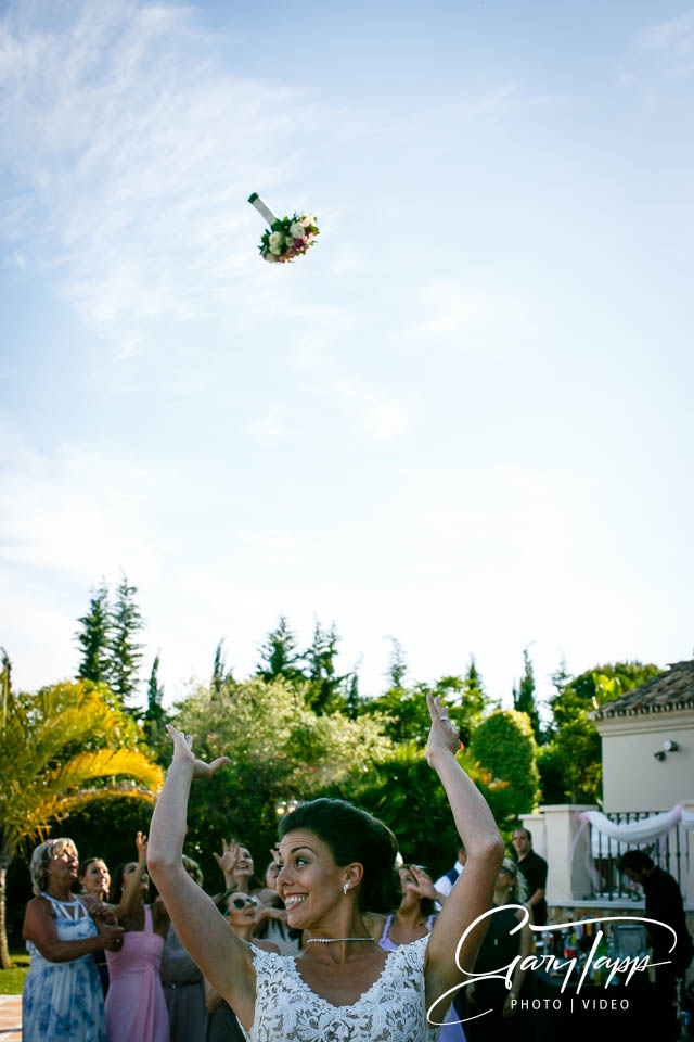 Bride throwing the bouquet at Villa Africa