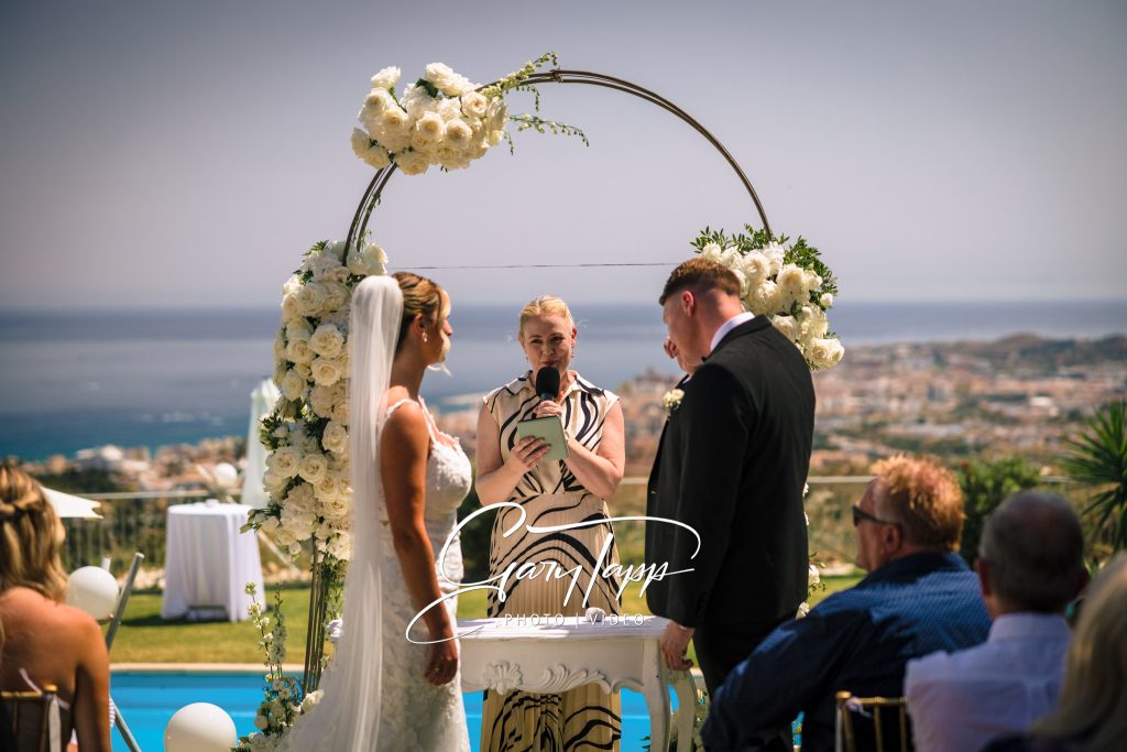 Finca Bella Vista Wedding Photographer | Mijas, Andalucia 2 Bride and grrom under the wedding arch at the Finca Bella Vista wedding venue