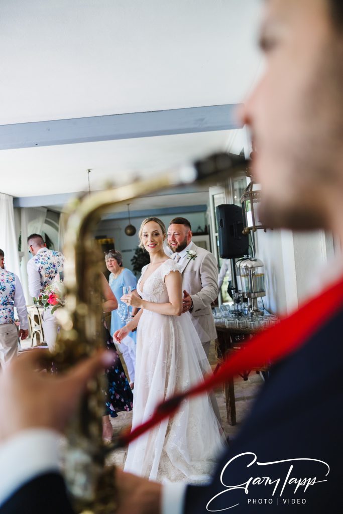 Bride and groom with thier sax player at Finca Monasterio