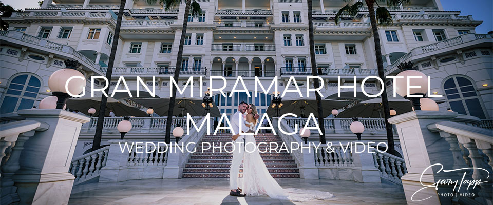 Bride and Groom on the main stairs outside the Gran Hotel Miramar wedding venue in Malaga, Spain